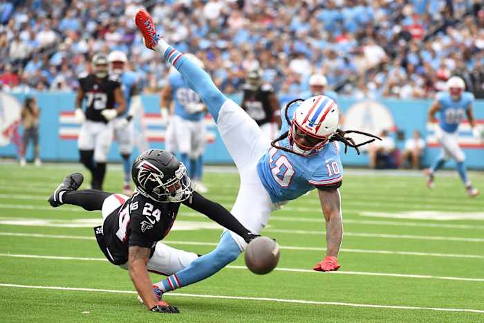 Tennessee Titans wide receiver DeAndre Hopkins (10) has a catch attempt broken up by Atlanta Falcons cornerback A.J. Terrell (24) during the first half at Nissan Stadium.